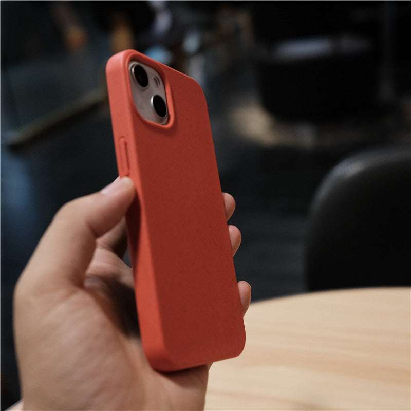 Red wheat straw eco-friendly protective phone case in red color held in hand
