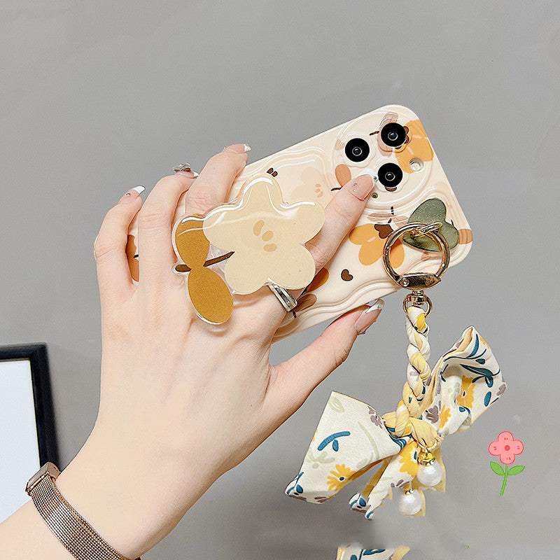 iPhone phone case with autumn leaves and flowers design, silicone texture, protective style, featuring bow silk scarf and ring holder.